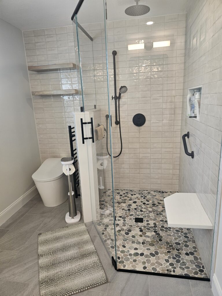 Primary bathroom remodel with improved flow after flipping shower and vanity positions