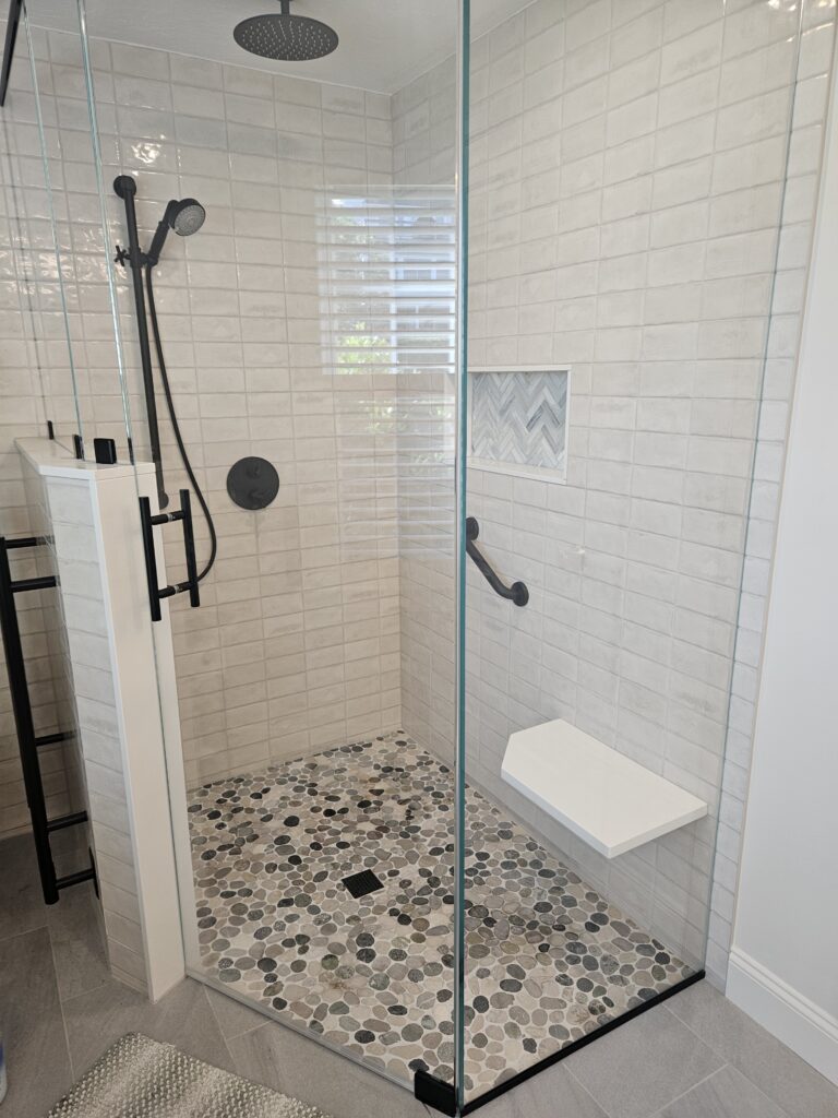 Larger custom tiled shower after floorplan flip in Plymouth MA